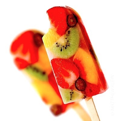 Pour Capri Sun into popsicle mold, add sliced fruit, then freeze